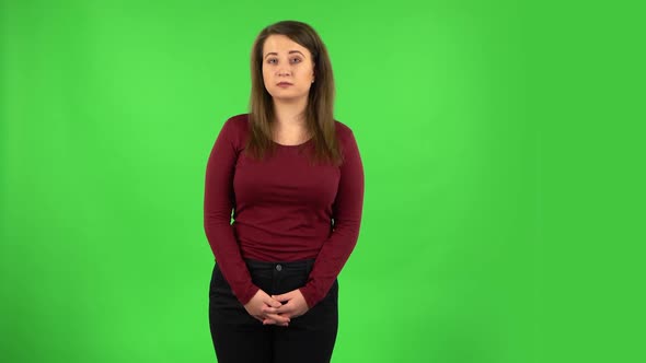 Pretty Girl Is Telling a Lot of Information. Green Screen