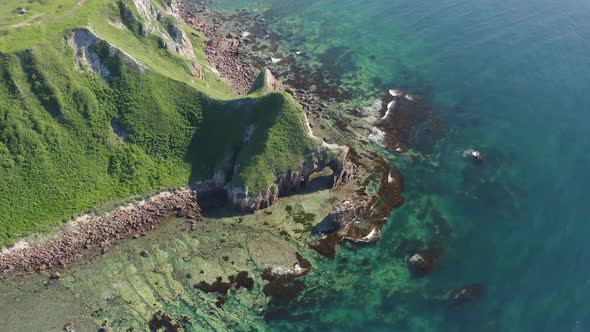 Drone View of a Natural Stone Arch By the Sea