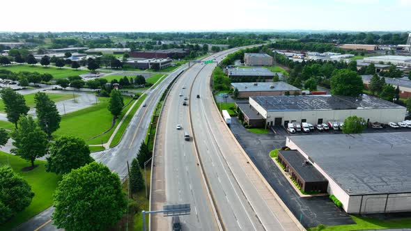 Drone view of cars traveling on large highway. Road system in America funded by tax payer dollars. C