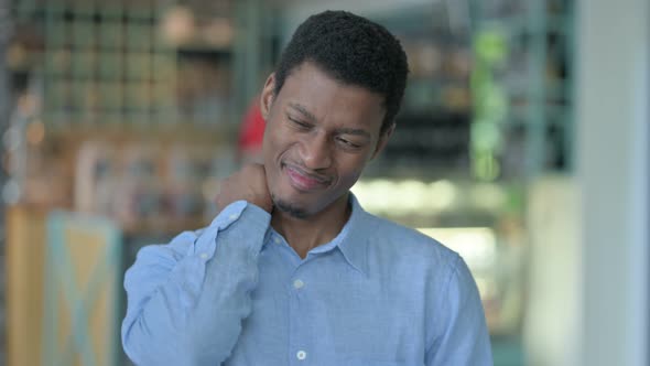 Tired Young African Man Having Neck Pain