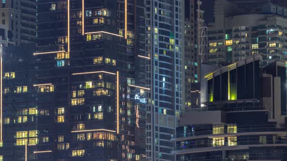 Night Night View of Multicolor Light in Windows of Multistory Buildings Aerial Timelapse