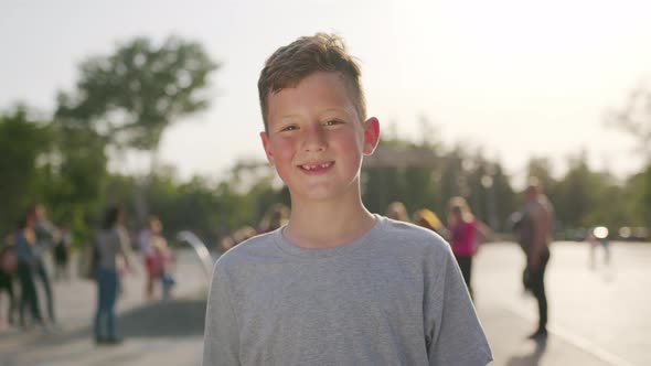 Close Up Portrait Happy Boy Smiling. Cheerful Enjoying Warm Summer.