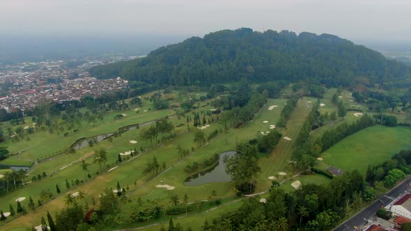 Aerial view on golf course at foothill of Tidar hill in Magelang, Java Indonesia