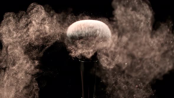 Super Slow Motion Closeup Shot of Makeup Powder Falling From Facial Brush at 1000Fps