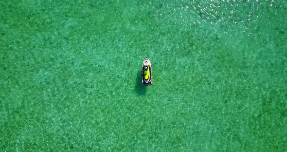 Beautiful aerial abstract shot of a white sandy paradise beach and aqua blue water background 