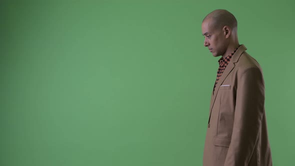 Profile View of Serious Bald Multi Ethnic Businessman