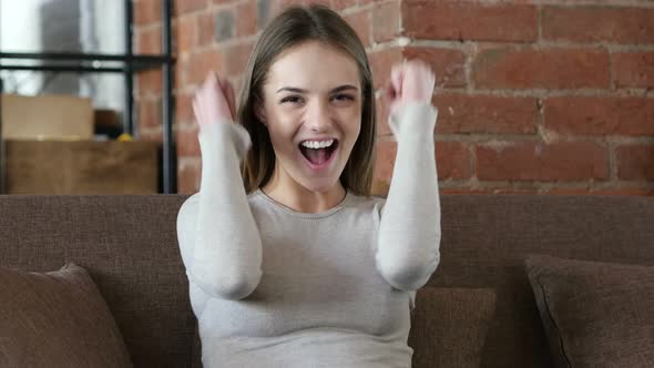 Woman Celebrating Success in Office