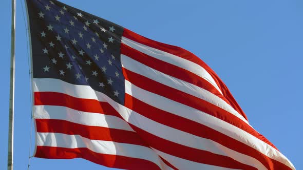 American USA Flag on a Flagpole Waving in the Wind alt