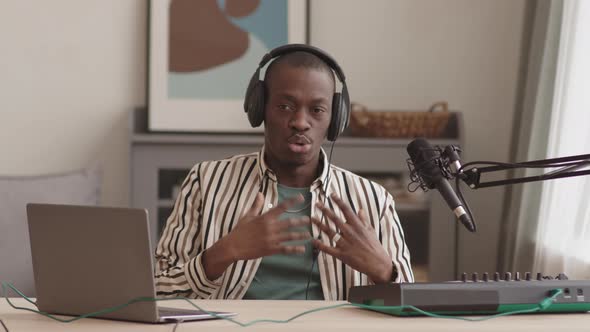 Handsome African Man Having Live Stream from Home Studio