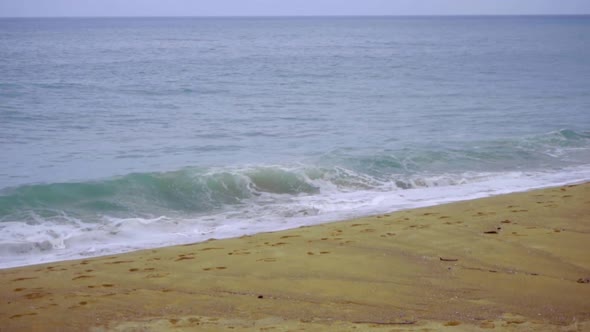 Powerful Wave Breaks Along the Shore