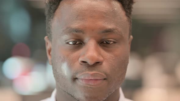 Close Up of African Businessman Looking at the Camera