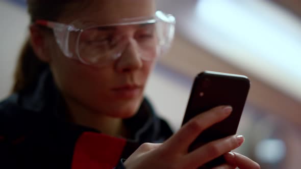 Emergency Medical Doctor Texting on Mobile Phone in Ambulance Car