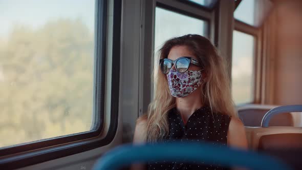 Woman In Transport Train In Protective Mask Sars COVID19 Virus.Pandemic Coronavirus Covid-19 Outdoor