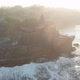 The sun dazzles the drone pickup over a Temple in Bali Indonesia - VideoHive Item for Sale