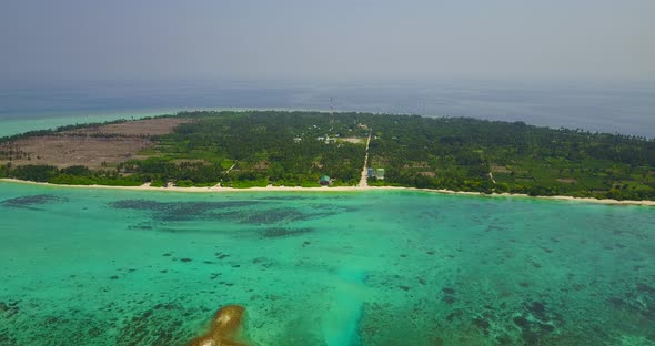 Tropical fly over island view of a summer white paradise sand beach and aqua blue ocean background i