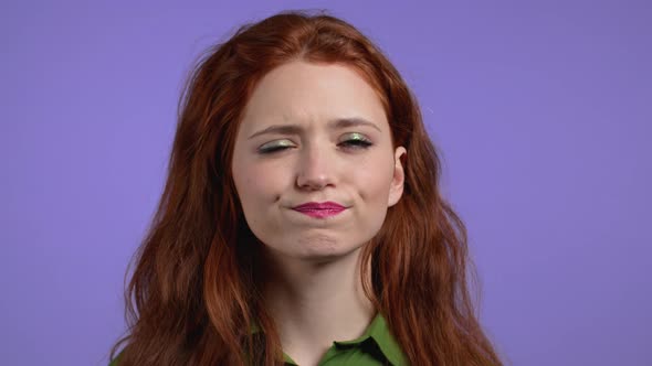 Portrait of Hesitant Woman on Purple Background