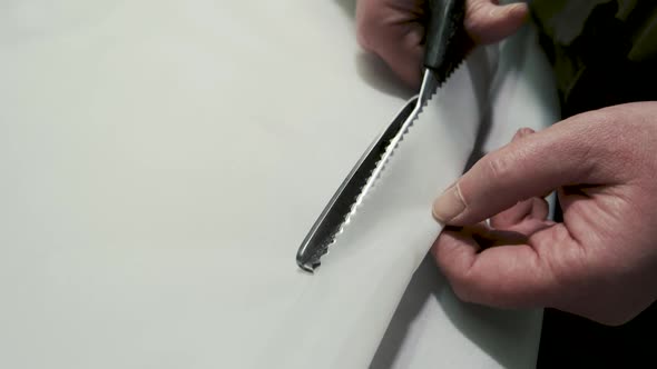 Scissors Cutting Cloth.