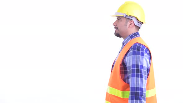Profile View of Happy Bearded Persian Man Construction Worker Smiling