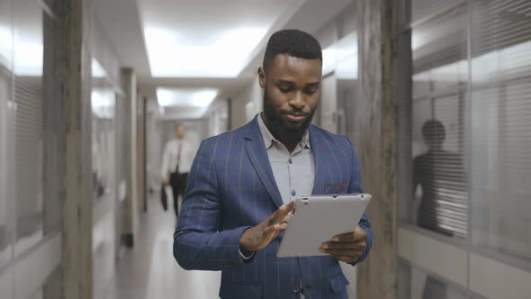 Office Manager with Tablet Going To Work