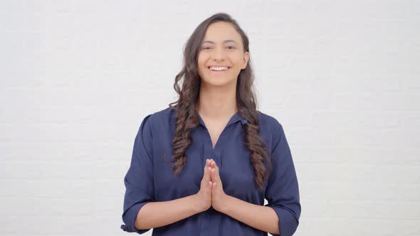 Indian girl greeting guests