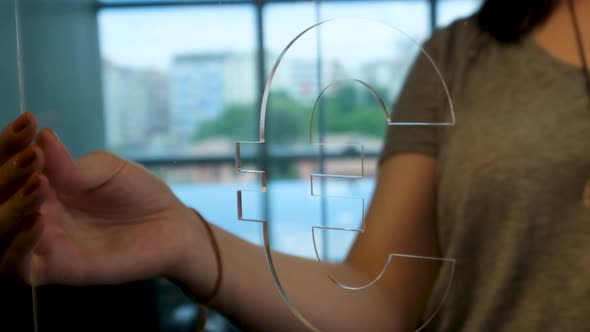 Woman Holding Glass Euro Sign