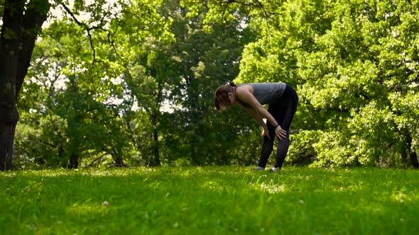 Girl Running in a Green Summer Park