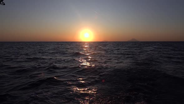 View From Moving Yacht on Mediterranean Sea and Sunset. Slow