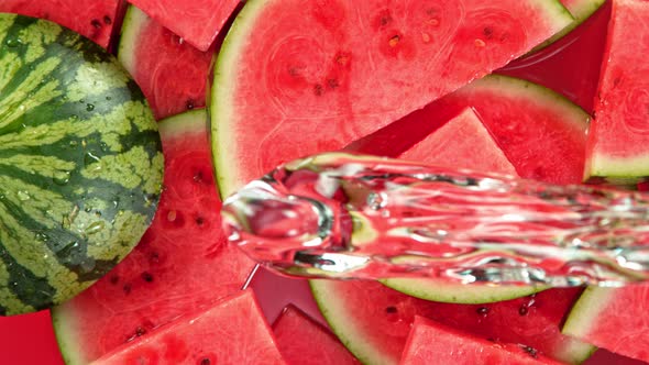 Super Slow Motion Shot of Splashing Water on Fresh Watermelon Slices at 1000Fps.