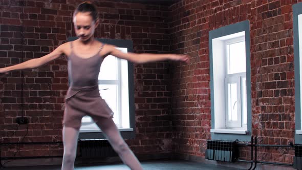 A Ballerina Girl Showing Her Dancing in the Studio