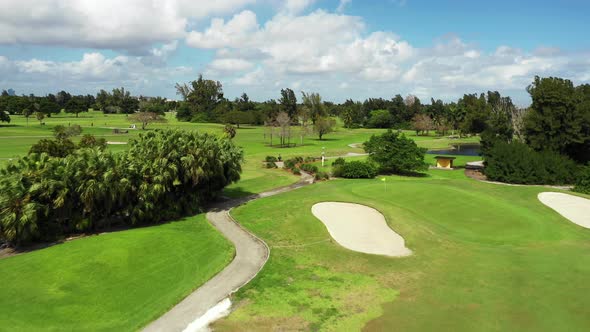 Aerial video golf course South Florida greenway