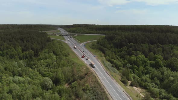 Aerial View of White Truck Passing Busy Highway