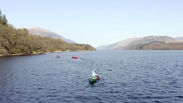 Large Group of Canoeists in a Lake Surrounded By Beautiful Landscape