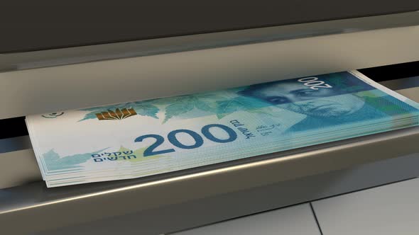 200 Israeli shekels in cash dispenser. Withdrawal of cash from an ATM.
