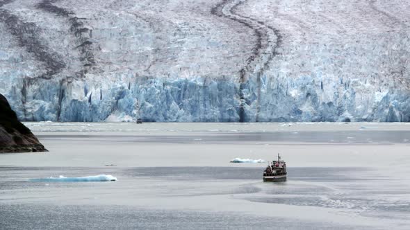 View of small ship near glacier