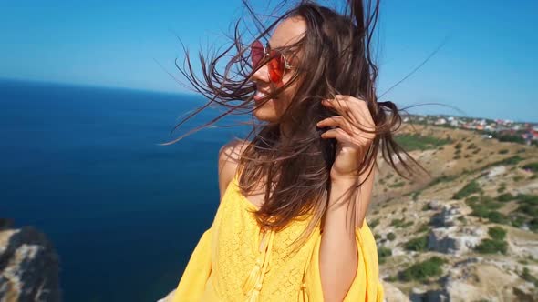 Closeup Clow Motion Portrait Beautiful Smiling Brunette Woman with Long Wind Blowing Hair