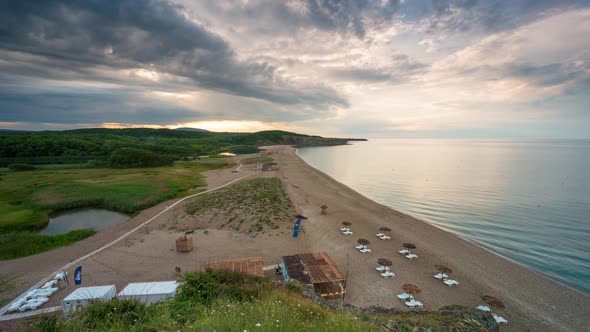 Time lapse with an empty wild beach at sunset.