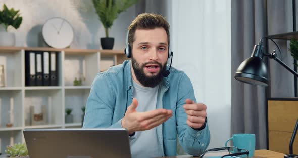 Male Blogger with Stylish Beard in Headset Recording Lifestyle Vblog for His Followers