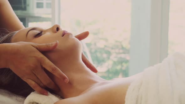 Woman Gets Facial and Head Massage in Luxury Spa