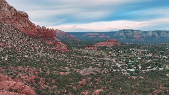 Aerial Wide Landscape Over Sedona Desert Town In Central Arizona. Drone Shot