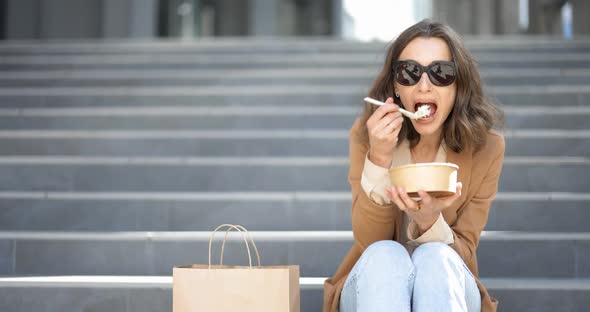 Office Worker Eating Takeaway Food Outdoors