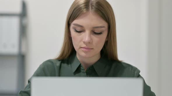 Portrait of Young Woman Using Laptop 