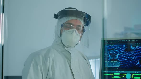 Microbiologist in Ppe Suit Standing in Laboratory Looking at Camera