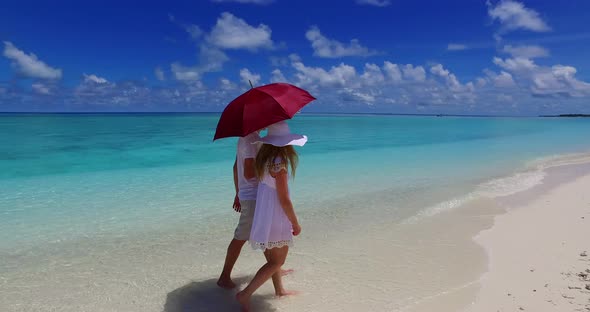 Romantic couple married on vacation enjoy life on beach on white sand background