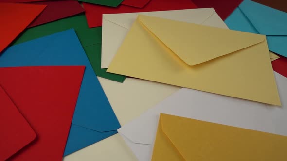 Falling multi-colored envelopes. Slow motion.