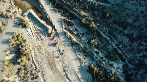 Flying over the desert next to the road