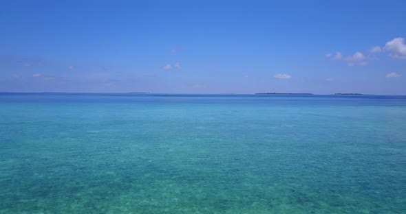 Natural aerial abstract shot of a white sandy paradise beach and blue ocean background in colourful 