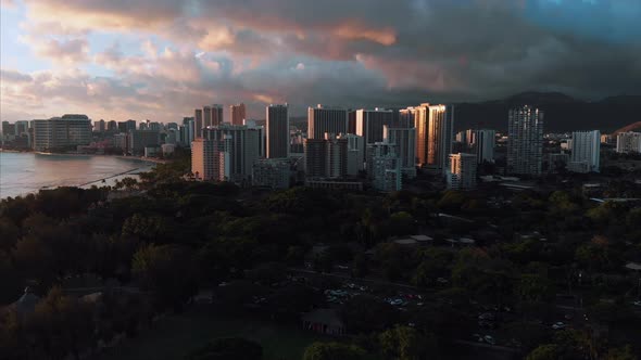 Aerial drone footage of Honolulu, Hawaii. Beautiful real estate, buildings in the city. Palm trees