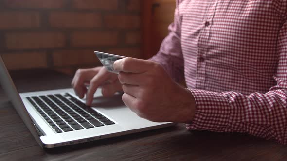 Buisnessman makes online internet shopping checkout with credit card payment