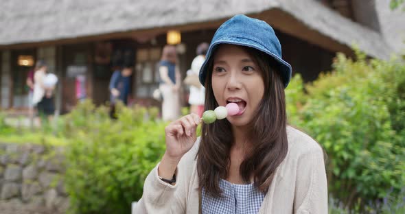 Woman eat dango in the countryside