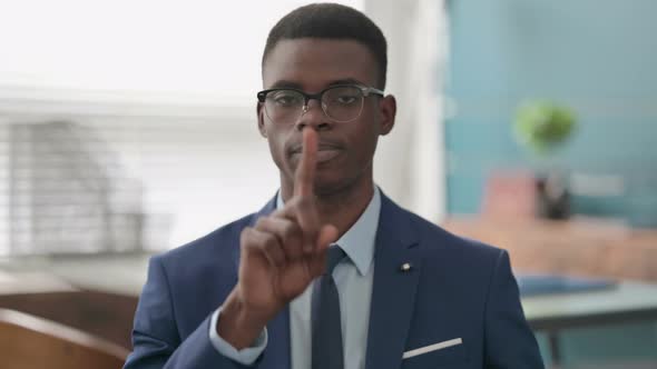 Young African Businessman Showing No Sign By Finger Denial